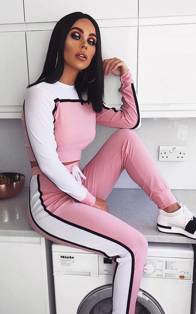 black tracksuit with red and white stripe